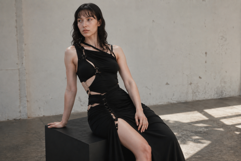 Sinéad O'Dwyer: Why Is Seeing a Normal Body on a Runway Still Radical? Slim model wearing a black Sinéad O'Dwyer cutout dress in a minimalist studio